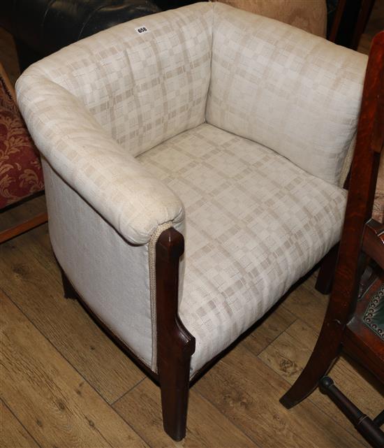 A 1930s oak tub chair